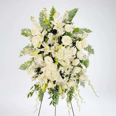Morningside Florist Rancho Cordova - An all white tribute, this funeral spray is pure and tranquil. Featuring a variety of white flowers and green palms this elegant funeral spray brings a feeling of peace to it's surroundings
