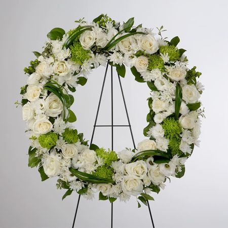 Morningside Florist Rancho Cordova - A beautiful white and green tribute wreath that calms, this easel arrangement celebrates a full life and a peaceful passing.