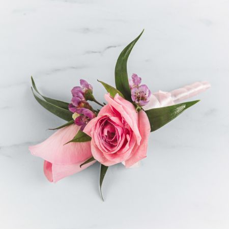 Morningside Florist Rancho Cordova - A classic pink rose boutonnière that compliments any suit. A perfect addition to any prom, formal, or wedding event.