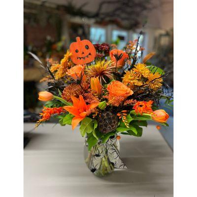 Morningside Florist Rancho Cordova - Enjoy this spooky treat with vibrant oranges as bright as a pumpkin, but look closely to see the spider hiding amongst the blooms 