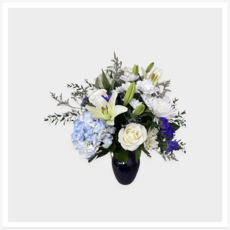 Blooms of Wayne Wayne - A timeless blend of crisp white and calming blue flowers arranged in a classic glass vase. This elegant design is perfect for sympathy, get well wishes, or sending a peaceful, refined gesture.

Hand-designed by our florists in Wayne using the freshest seasonal blooms available.

✔ Same-day flower delivery in Wayne, NJ
✔ Designed by a real local florist (not shipped in a box)
✔ Available in Standard, Deluxe, and Premium sizes