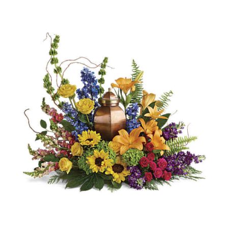Blooms of Wayne Wayne - Express your deepest sympathy and enduring love with ‘With All Our Hearts’, a radiant tribute brimming with sunflowers, lilies, and vibrant blooms. This stunning sympathy arrangement, centered with a warm, copper-toned keepsake urn, offers a comforting embrace during times of loss. Lush textures and a spectrum of heartfelt colors create a beautiful and lasting memorial to celebrate a life well-lived. Send solace and remembrance with this exquisite flower arrangement, a beacon of hope and peace.