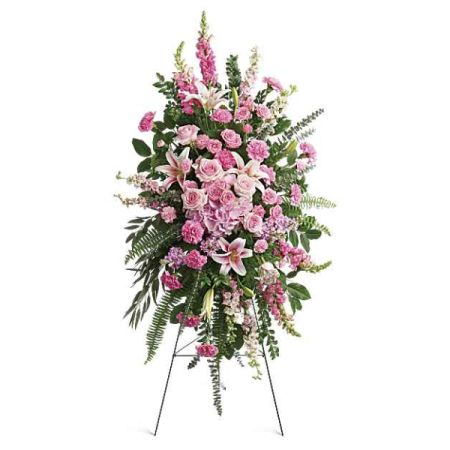 Blooms of Wayne Wayne - Send comfort and express your deepest sympathy with ‘Glorious Farewell’, a stunning tribute of soft pink roses, elegant lilies, and delicate carnations. 
This breathtaking "sympathy standing spray"offers a graceful expression of peace and remembrance, beautifully arranged with lush greenery. 
Perfect for "funeral flowers" or to offer condolences, its gentle hues and fragrant blooms convey heartfelt support during a difficult time.
A truly "beautiful flower arrangement" to honor a loved one’s memory with serenity and love.