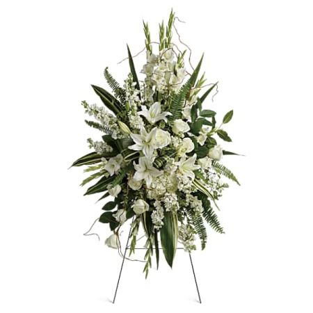 Blooms of Wayne Wayne - Express your deepest condolences with 'Heartfelt Sympathy', a standing spray of pure white lilies, roses, and fragrant stock. Lush ferns and delicate accents create a comforting and serene tribute, embodying peace and remembrance. This elegant "sympathy flower arrangement" offers a graceful expression of love during times of loss. Send solace and support with this beautiful "funeral flower" design, a beacon of hope and quiet strength.