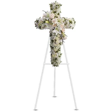 Blooms of Wayne Wayne - Express your deepest sympathy and reverence with 'Divine Light', a stunning floral cross crafted in shades of peaceful white and blush. 
Delicate lilies, roses, and hydrangeas are interwoven to create a breathtaking tribute, radiating serenity and grace.
Standing as a beautiful symbol of faith and remembrance, this sympathy arrangement offers comfort during times of loss.
Send a heartfelt message of hope and peace with this elegant *funeral flower* arrangement, perfect for services or to express condolences.