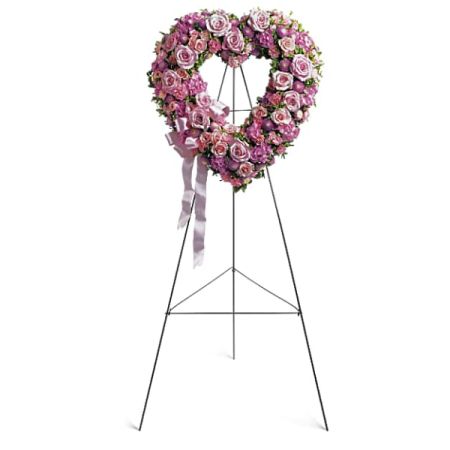 Blooms of Wayne Wayne - Express your deepest love and sympathy with our breathtaking Rose Garden Heart, a stunning tribute of lavender and pink roses. This elegant floral heart, expertly crafted on a graceful stand, radiates a sweet, comforting fragrance and a visual warmth. Send this unforgettable **rose heart arrangement** to offer solace during difficult times or celebrate a cherished connection. A beautiful gesture of remembrance, affection, and enduring love, perfect for **funeral flowers** or expressing heartfelt emotions.