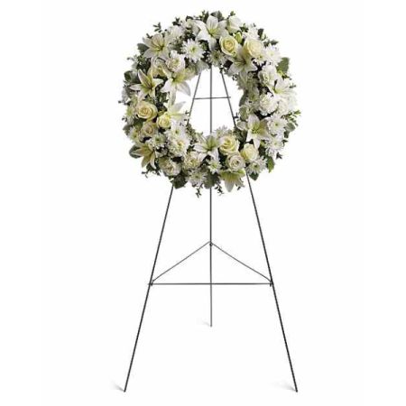 Blooms of Wayne Wayne - The 'Serenity Wreath' is a stunning tribute of peace and remembrance, cascading with ivory roses, lilies and carnations. 
A graceful circle of fresh flowers, designed to offer comfort and express heartfelt sympathy with a calming, elegant presence.
Perfect for memorial services, funerals, or as a gesture of support during times of loss, this wreath speaks volumes without saying a word.
Send a beautiful expression of love and lasting condolences with this timeless sympathy wreath, a beacon of hope and serenity.