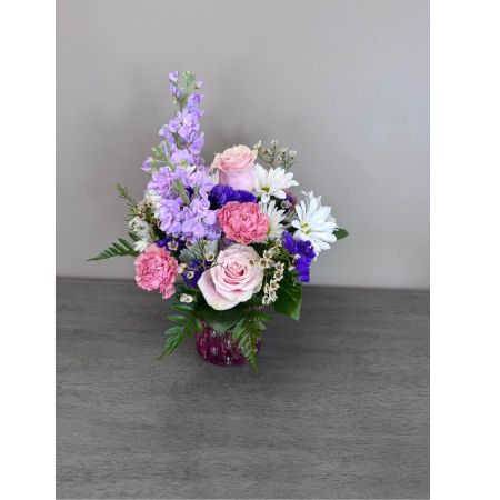 Blooms of Wayne Wayne - Bathed in the softest hues of spring 'Mom’s Favorite' is a bouquet designed to express all the warmth and gratitude you feel. Imagine the gentle fragrance filling a room a comforting embrace captured in blooms. This arrangement features a lush gathering of roses carnations and alstroemeria all carefully selected for their delicate beauty and long-lasting freshness. Perfect for Mother’s Day birthdays or simply to say ‘I love you’ this stunning display speaks volumes without uttering a single word. Send a little piece of sunshine to brighten her day and remind her of the joy she brings to your life with this beautiful flower arrangement.