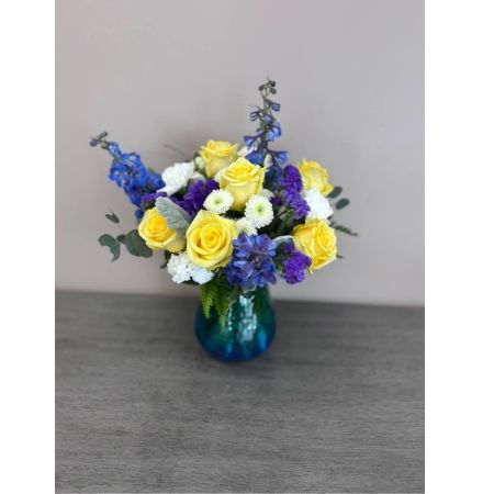Blooms of Wayne Wayne - Bring the breezy sophisticated charm of the Atlantic coastline into any space with 'East Coast Living'. This stunning floral arrangement evokes the feeling of sun-drenched beaches salty air and peaceful moments. Soft textures and a calming palette create a sense of relaxed elegance perfect for brightening a home or expressing heartfelt sympathy. Imagine the delicate fragrance filling a room or the joy on a loved one’s face as they receive this beautiful token of affection. This is more than just flowers; it's a breath of fresh air a coastal escape and a reminder of tranquility. Perfect for housewarming gifts celebrations of life or simply to uplift the spirit.