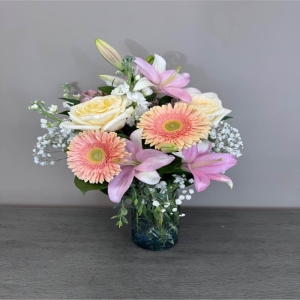 Blooms of Wayne Wayne - Drift away to a realm of soft beauty with 'Pastel Petals' a captivating flower arrangement designed to evoke feelings of serenity and joy. This stunning bouquet is a delicate symphony of form and fragrance perfect for expressing sweet sentiments or simply brightening your own space. Imagine the gentle blush of roses whispering promises of affection while the airy grace of stock adds a touch of tranquility . 'Pastel Petals' isn't just a bouquet; it's a moment of peace captured in blooms – an ideal gift for birthdays anniversaries or as a thoughtful 'just because' gesture.  Bring the quiet luxury of spring into any home with this breathtaking arrangement.  It's a soft beautiful statement for any occasion radiating warmth and affection.