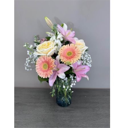 Blooms of Wayne Wayne - Drift away to a realm of soft beauty with 'Pastel Petals' a captivating flower arrangement designed to evoke feelings of serenity and joy. This stunning bouquet is a delicate symphony of form and fragrance perfect for expressing sweet sentiments or simply brightening your own space. Imagine the gentle blush of roses whispering promises of affection while the airy grace of stock adds a touch of tranquility . 'Pastel Petals' isn't just a bouquet; it's a moment of peace captured in blooms – an ideal gift for birthdays anniversaries or as a thoughtful 'just because' gesture.  Bring the quiet luxury of spring into any home with this breathtaking arrangement.  It's a soft beautiful statement for any occasion radiating warmth and affection.
