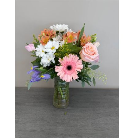 Blooms of Wayne Wayne - Breathe in the essence of a blossoming garden with ‘It’s a Spring Thing!’ This exquisite arrangement captures the joyful spirit of the season overflowing with fresh vibrant blooms. Imagine a sun-drenched windowsill graced by these cheerful stems or the delight on a loved one's face as they receive this burst of natural beauty. Delicate textures and layered colors create a captivating display evoking warmth and renewal. Perfect for celebrating new beginnings sending a thoughtful ‘just because’ gift or simply bringing a little piece of springtime indoors. This is more than just flowers; it’s a feeling of happiness delivered.