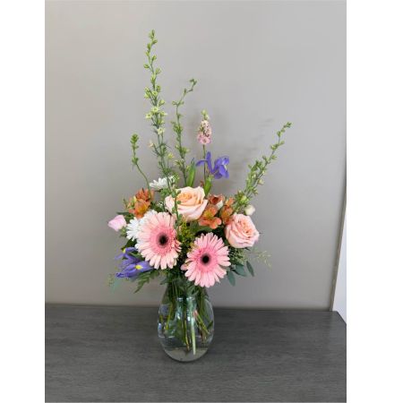 Blooms of Wayne Wayne - Evoke feelings of warmth and affection with 'You Still Make Me Blush' a stunning bouquet designed to capture the sweet essence of enduring love. This arrangement is a symphony of delicate textures and romantic hues perfect for anniversaries ‘just because’ moments or expressing your deepest admiration. Soft peach roses known for their timeless beauty intertwine with the cheerful radiance of light peach gerber daisies and the airy grace of lisianthus. A touch of greenery provides a fresh natural backdrop enhancing the bouquet’s overall elegance. Imagine the recipient's delight as they receive this captivating display – a fragrant visual embrace that speaks volumes without saying a word. Send a little piece of happiness and remind someone special how much they are loved with this charming floral creation. This beautiful flower arrangement is ideal for someone who loves classic romance soft colors and fresh flowers. 
