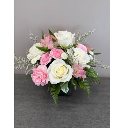 Blooms of Wayne Wayne - Bring a burst of cheerful energy into any space with 'Pops of Pink'! This captivating arrangement is a delightful medley of soft and vibrant blooms designed to evoke feelings of joy and appreciation. Imagine the sweet fragrance gently filling a room the delicate petals creating a visually stunning focal point on a bedside table or the warm blush tones brightening a friend’s day. This isn’t just a bouquet; it’s a little piece of sunshine perfect for celebrating life’s simple moments expressing gratitude or simply treating yourself to a touch of beauty. Whether it’s a birthday surprise a ‘thinking of you’ gesture or a heartfelt 'get well soon' wish 'Pops of Pink' communicates warmth and affection with every petal. Let this exquisite flower arrangement tell a story of love and happiness.