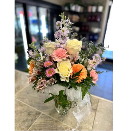 Blooms of Wayne Wayne - Bathed in the warm glow of a summer sunset 'Summer Radiance' is more than just an arrangement; it’s a burst of joyful color and fragrant bliss. Imagine the delicate perfume filling a room bringing the outdoors in and instantly lifting spirits. This stunning bouquet features a lively mix of blooms expertly arranged to capture the season’s essence. Picture it gracing your own dining table brightening a loved one’s day or expressing heartfelt sympathy with a touch of vibrant hope.  Each stem has been carefully selected for its freshness and beauty promising a long-lasting display of nature's artistry.  Send a little sunshine with 'Summer Radiance' - the perfect gift for birthdays celebrations or simply to say ‘thinking of you’. This is a beautiful choice for fresh flower delivery.