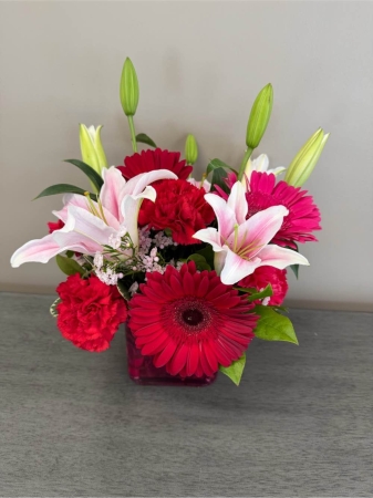 Blooms of Wayne Wayne - Capture the timeless beauty of affection with 'Classic Lovestory'. This exquisite bouquet is a symphony of romance designed to express feelings that words simply cannot convey. Imagine the gentle fragrance filling a room, the soft petals beckoning a touch and the vibrant hues evoking a sense of pure joy.  Perfect for anniversaries, celebrations of love or simply to remind someone special how much they mean to you. This arrangement features a harmonious blend of classic blooms, each one carefully selected for its symbolism and delicate charm. ‘Classic Lovestory’ isn’t just flowers; it’s a moment of tenderness beautifully presented.  Send a lasting expression of your heart today with this breathtaking gift. This gorgeous arrangement will leave a lasting impression with its elegance and grace.