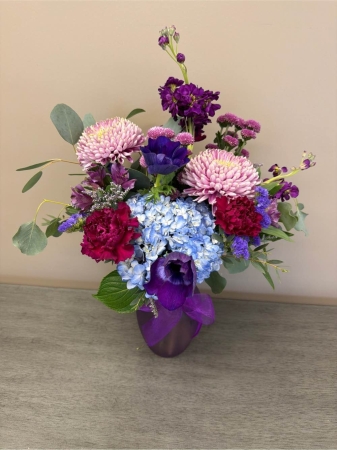 Blooms of Wayne Wayne - Immerse yourself in the delicate beauty of 'Royal Blush' a stunning floral arrangement designed to evoke feelings of grace and admiration. This captivating bouquet is a symphony of bold textures and romantic hues perfect for expressing heartfelt sentiments or simply brightening a cherished space. Imagine the gentle fragrance filling a room, a subtle whisper of elegance as the light catches the velvety petals.  'Royal Blush' features a harmonious blend of full-bodied blooms and delicate accents creating a truly unforgettable. Bring the timeless allure of a royal garden into your life with 'Royal Blush'. This is more than flowers; it’s an experience. A captivating gift for birthdays, anniversaries or to show someone you care. 