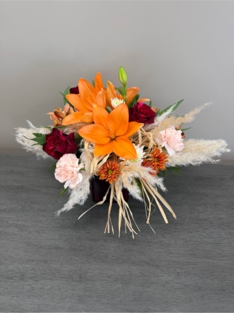 Blooms of Wayne Wayne - Embrace the season’s quiet beauty with ‘Step Gently into Fall’. This exquisite arrangement captures the warmth and transition of autumn in a stunning display of color and texture. Imagine the rich fragrance subtly filling a room evoking cozy evenings and the crispness of falling leaves. Sun-kissed blooms mingle with delicate sprays creating a harmonious composition perfect for welcoming guests, expressing gratitude or simply bringing the outdoors in. This isn't just a bouquet; it’s a moment of autumnal serenity designed to be cherished. Send the feeling of comfort and joy to someone special or treat yourself to a little piece of fall’s magic. 