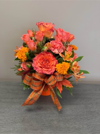 Blooms of Wayne Wayne - Ignite the senses with ‘Orange Crush’ a vibrant bouquet designed to bring sunshine into any space. This stunning arrangement is a burst of energy perfect for celebrating life’s joyful moments or simply brightening someone's day. Imagine the warm glow of these blooms gracing a kitchen table, adding a touch of zest to a morning coffee or offering a comforting embrace on a cozy evening. The rich layered textures and intoxicating fragrance create an experience that's both visually captivating and delightfully aromatic. ‘Orange Crush’ isn’t just flowers; it’s a feeling of happiness delivered.  Whether it's a thank you, a ‘get well soon’ gesture or a spontaneous expression of love this bouquet speaks volumes. Order yours today and share the warmth of orange.