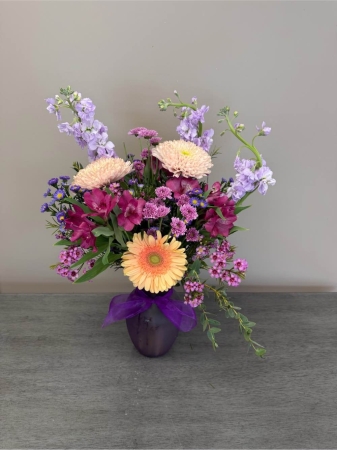 Blooms of Wayne Wayne - Bathed in the soft glow of sunset hues, 'A Touch of Peach' is a captivating floral arrangement designed to evoke feelings of warmth, gratitude and gentle affection. This stunning bouquet is a harmonious blend of delicate textures and the subtle sweetness of peach-toned blooms. Imagine this arrangement brightening a loved one's home, filling the room with a calming fragrance and a sense of serene beauty. Perfect for celebrating a special occasion, offering heartfelt sympathy or simply showing someone you care 'A Touch of Peach' speaks volumes without saying a word. It’s a beautiful expression of kindness,  joy and understated elegance – a little piece of sunshine to brighten any day. These fresh cut flowers are expertly arranged and guaranteed to deliver lasting beauty.