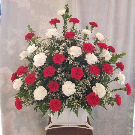 Log Cabin Florist Bakersfield -  A large beautiful bouquet of red and white carnations convey your heartfelt sympathy.  Approx 36" H x 36" W.