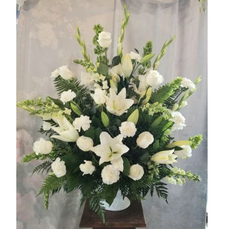 Log Cabin Florist Bakersfield - The all white arrangement is a beautiful tribute that stands out at a visitation or a service. Approx. 36"H x 33"W  **Flowers may vary depending upon availability**