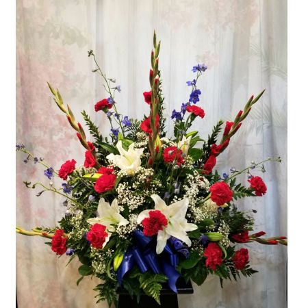 Log Cabin Florist Bakersfield - A Beautiful Tribute To Someone Who Respected The Red White And Blue. Approx. 31"H x 35"W ***Flowers may vary depending upon availability***