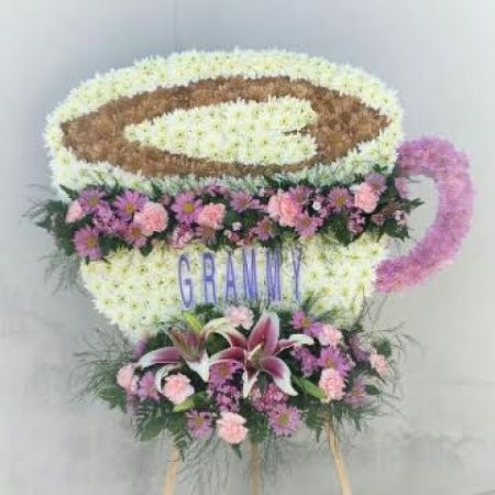 Log Cabin Florist Bakersfield - FOR THOSE WHO LOVE LATTES AND LOVE LIFE THIS VERY PERSONAL DESIGN SPEAKS TO THE MEMORY OF A SPECIAL LOVED ONE. LET LOG CABIN FLORIST DESIGN A ONE OF A KIND FINAL TRIBUTE TO CAPTURE THE PERSONALITY OF YOUR MOST PRECIOUS LOVED ONE.