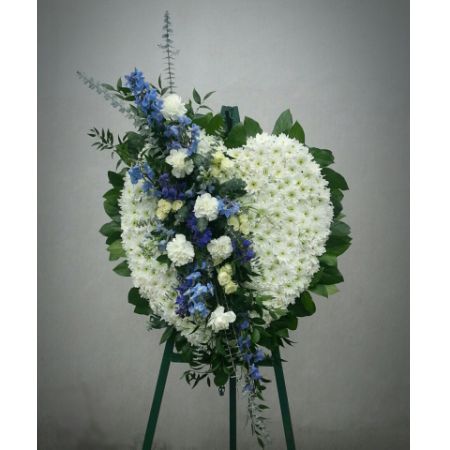 Log Cabin Florist Bakersfield - A large 24" full heart with a soft blue cluster. Love, love my love is blue....forever in your heart.
This display stands over 6ft tall and 30" wide.