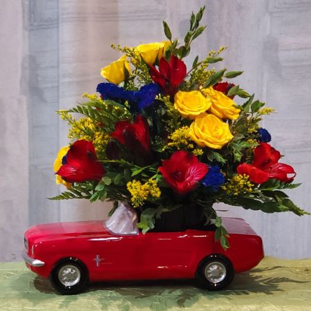 Log Cabin Florist Bakersfield - Cute little bouquet in a red Ford Mustang with a mixed bouquet of alstro, spray roses, statice, solidago ***Flowers may vary depending upon availability***