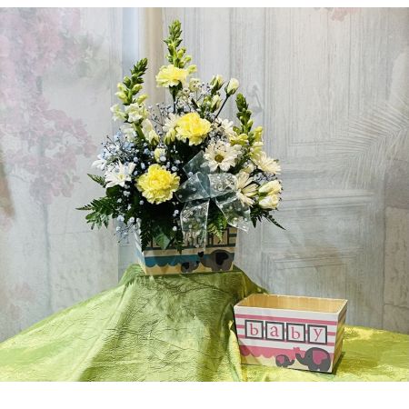 Log Cabin Florist Bakersfield - Welcome the precious bundle of joy with our charming arrangement designed for either a boy or a girl. Presented in a wooden box, this delightful ensemble features a mix of carnations, poms, roses, snaps, and filler. Please note that flower selection may vary based on availability, ensuring a fresh and lovely bouquet. Take advantage of our same-day flower delivery to share in the joy of the new arrival.
