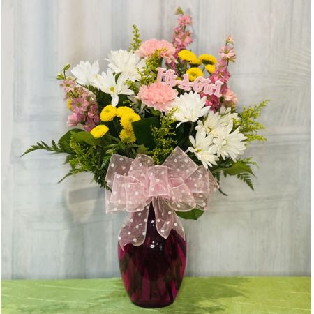 Log Cabin Florist Bakersfield - Celebrate the arrival of a baby girl with this charming arrangement featuring yellow button poms, white cushion poms, pink carnations, pink larkspur, and solidago. Adorned with a pink polka dot bow and an "It's a Girl" pick, this ensemble is a sweet and joyful expression of congratulations. Approximately 21 inches in height and 11 inches in width, this bouquet adds a touch of warmth to the occasion. Note that flower selection may vary based on availability, ensuring a fresh and delightful arrangement. Enjoy the convenience of same-day flower delivery to share your best wishes for the precious little one.






