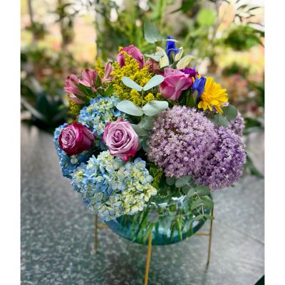 DiBella Flowers & Gifts Las Vegas - Roses, hydrangeas, iris, lilies, allium and more in keepsake blue vase with gold pedestal. 