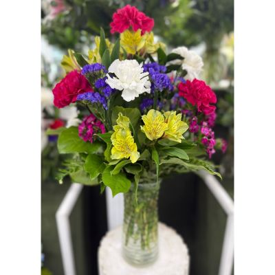 DiBella Flowers & Gifts Las Vegas - BRIGHT PINK AND YELLOW ARRANGEMENT IN THE COOLER