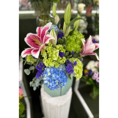 DiBella Flowers & Gifts Las Vegas - AQUA BLUE GARDEN ARRANGEMENT IN THE COOLER