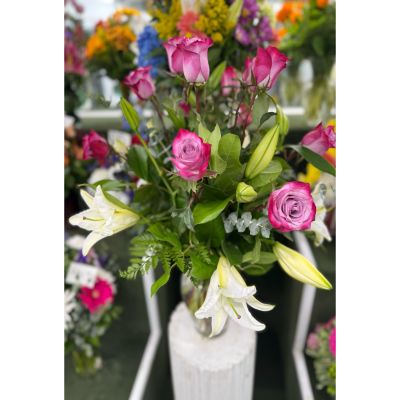 DiBella Flowers & Gifts Las Vegas - DOZEN LAVENDER ROSES AND WHITE LILY ARRANGEMENT IN THE COOLER