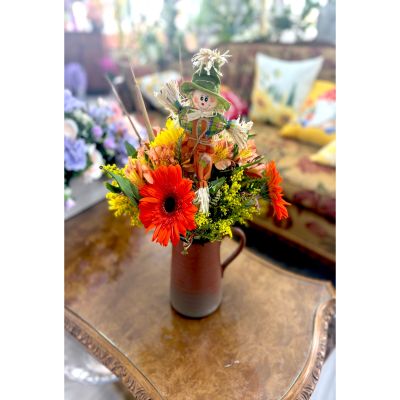 DiBella Flowers & Gifts Las Vegas - Celebrate the season of gratitude with this charming Thanksgiving bouquet, featuring vibrant autumn blooms and a playful scarecrow accent. A perfect touch of harvest cheer for your holiday table or as a thoughtful gift.