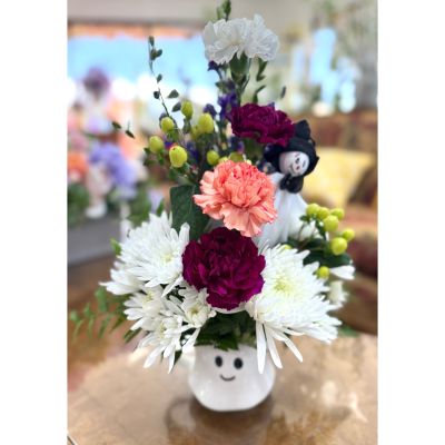 DiBella Flowers & Gifts Las Vegas - Add a touch of spooky sweetness to the season with our Boo Mug Blooms! This playful arrangement is designed in a charming ghost mug, brimming with festive flowers in bright autumn tones. Perfect as a Halloween gift, party decoration, or a treat for yourself. This keepsake mug will continue to bring you a smile.  