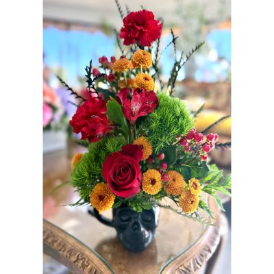DiBella Flowers & Gifts Las Vegas - Bold, dramatic, and full of seasonal flair, this striking arrangement captures the perfect balance between mystery and warmth. Designed in a sculpted black skull vessel, it evokes the spirit of fall festivities and adds a touch of edgy sophistication to any setting. Ideal for Halloween gatherings, autumn décor, or anyone who loves a creative twist on classic seasonal beauty, this piece is sure to be a conversation starter. Available for same-day pickup or delivery at our Las Vegas location.
