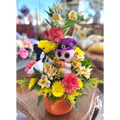 DiBella Flowers & Gifts Las Vegas - This adorable ghostie, dressed in a purple witch hat and clutching a tiny jack-o’-lantern, is here to brew up smiles and a little Halloween magic. It’s the perfect way to add a dash of whimsy and warmth to your Halloween celebrations! 