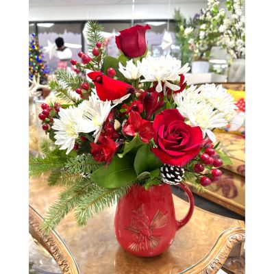 DiBella Flowers & Gifts Las Vegas - Bursting with holiday spirit, Crimson Cardinal Cheer captures the magic of winter with radiant red roses, snowy white blooms, and festive evergreens. Frost-tipped pinecones and a charming cardinal accent bring a touch of nature's joy, making this arrangement a perfect gift to celebrate the season.