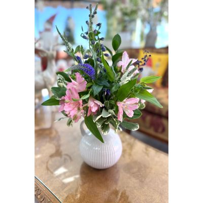 DiBella Flowers & Gifts Las Vegas - Brighten any space with this charming mix of fresh blooms in soft pink tones. Featuring delicate alstroemeria, vibrant roses, and lush greenery, this arrangement brings a touch of grace and cheer to every occasion. Designed in a classic white vase, it’s perfect for birthdays, get-well wishes, or simply adding beauty to the home.