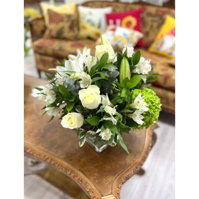 DiBella Flowers & Gifts Las Vegas - Capture the serene beauty of winter with Winter Whisper, a graceful all-white arrangement designed to evoke fresh snowfall and timeless elegance. Featuring a luxurious blend of crisp white blooms accented with soft seasonal greenery, this arrangement brings calm, beauty, and sophistication to any space. Perfect for winter celebrations, sympathy, holiday décor, or simply brightening a room during the colder months. Hand-crafted with care and available for same-day delivery, Winter Whisper is a stunning expression of purity, peace, and seasonal charm.