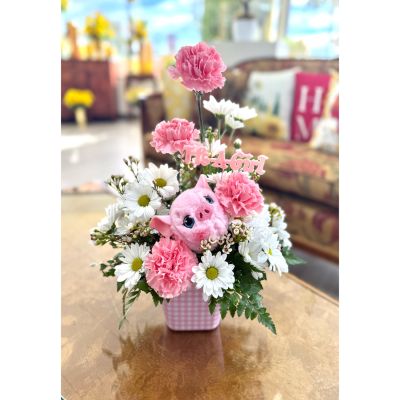 DiBella Flowers & Gifts Las Vegas - My Little Piggy is an irresistibly sweet arrangement designed to celebrate the arrival of a precious baby girl. Soft pink blooms and cheerful white daisies create a gentle, joyful palette, while lush greenery adds a fresh, garden-inspired touch. Nestled among the flowers is an adorable plush friend, bringing extra charm and cuddles to this keepsake design. Perfect for welcoming baby with love, smiles, and a whole lot of sweetness.