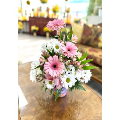 DiBella Flowers & Gifts Las Vegas - Celebrate the arrival of a precious baby girl with this charming pink floral arrangement. Designed in soft blush tones, it features cheerful pink gerbera daisies, delicate white daisies, and graceful pink alstroemeria, all nestled among fresh greenery. Arranged in an adorable keepsake container, this bouquet is finished with a sweet pink ribbon for the perfect welcoming touch. A beautiful way to share love, joy, and warm congratulations for a new little bundle of happiness.