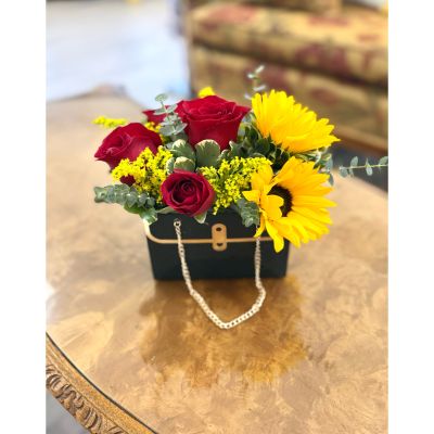 DiBella Flowers & Gifts Las Vegas - Brighten their day with the Sunlit Vibrance Tote, a cheerful blend of sunflowers and red roses designed for same day Las Vegas flower delivery. Perfect for birthdays, thank you gifts, or just because, this compact tote arrangement delivers bold color and fresh seasonal blooms in a stylish, gift-ready design. Handcrafted locally by DiBella Flowers and Gifts for reliable Las Vegas delivery.