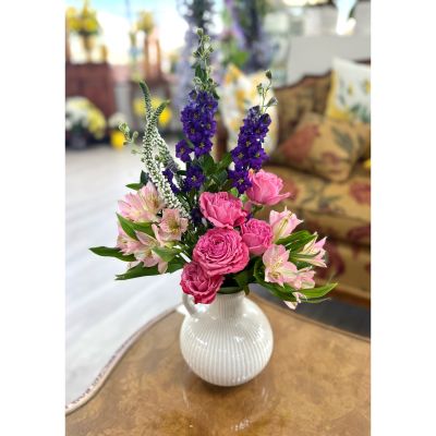 DiBella Flowers & Gifts Las Vegas - Brighten any space with this charming mix of fresh blooms in soft pink tones. Featuring delicate alstroemeria, vibrant roses, and lush greenery, this arrangement brings a touch of grace and cheer to every occasion. Designed in a classic white vase, it’s perfect for birthdays, get-well wishes, or simply adding beauty to the home.