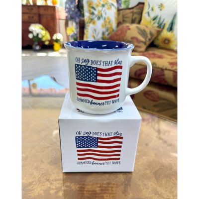 DiBella Flowers & Gifts Las Vegas - Celebrate everyday moments with a touch of patriotic charm with this classic American flag mug. Featuring a beautifully detailed stars and stripes design alongside the iconic “Oh say does that star-spangled banner yet wave” lyric, this mug is perfect for those who love country and tradition.

With its crisp white finish and bold red, white, and blue accents, it’s a timeless piece that stands out whether you’re enjoying your morning coffee or evening tea. The deep blue interior adds an extra pop of color, while the sturdy design makes it ideal for daily use.