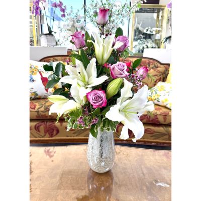 DiBella Flowers & Gifts Las Vegas - Elegant and luminous, Mother of Pearl features fragrant white lilies paired with soft pink and lavender roses in a textured pearly white glass vase, creating a timeless, upscale look. Perfect for birthdays, sympathy, or a thoughtful surprise, this arrangement is ideal for same-day flower delivery Las Vegas and last-minute gifting. Hand-designed by DiBella Flowers and Gifts, it’s a refined choice for anyone searching for luxury Las Vegas flower delivery with same-day service.