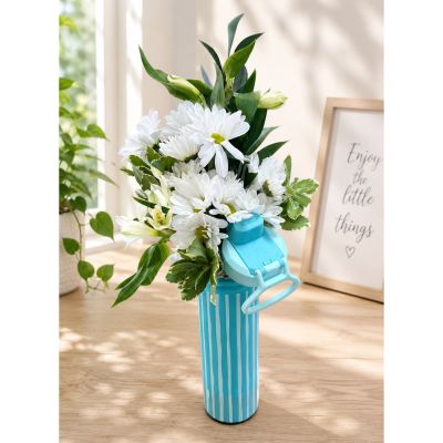 DiBella Flowers & Gifts Las Vegas - Bring a breath of fresh air to any occasion with Coastal Bottle Blooms, a charming floral arrangement designed in a reusable light blue striped water bottle. Filled with crisp white blooms and lush greenery, this cheerful gift is perfect for birthdays, get well wishes, thank you gifts, or simply letting someone know you're thinking of them. The reusable bottle makes a fun keepsake long after the flowers have been enjoyed. Flower varieties may vary based on seasonal availability while maintaining the overall color palette and style. Order from DiBella Flowers & Gifts for same-day Las Vegas flower delivery when available.